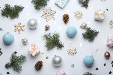 Composition with Christmas decorations on white background, top view. Winter season