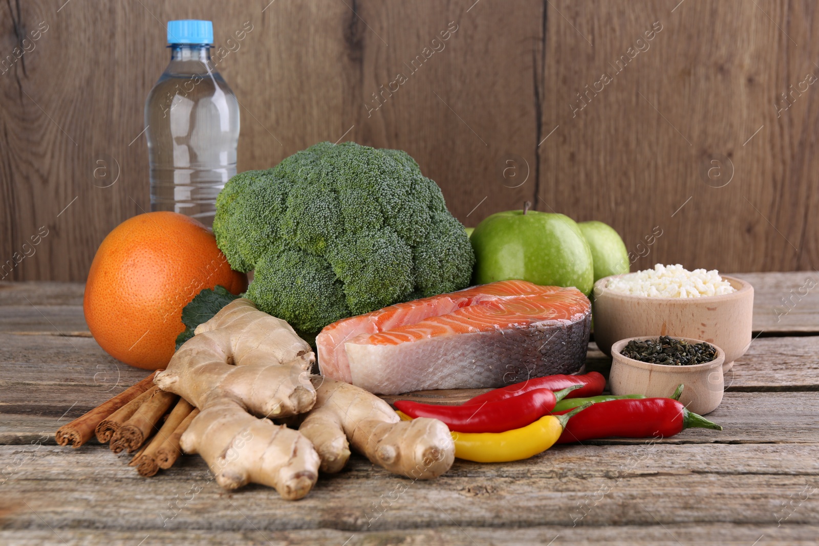 Photo of Metabolism. Different food products on wooden table