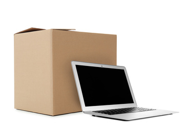 Image of Online selling. Laptop and parcel on white background