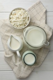 Lactose free dairy products on white wooden table, top view