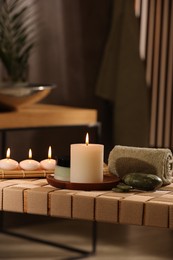 Beautiful composition with different spa products on wicker bench indoors