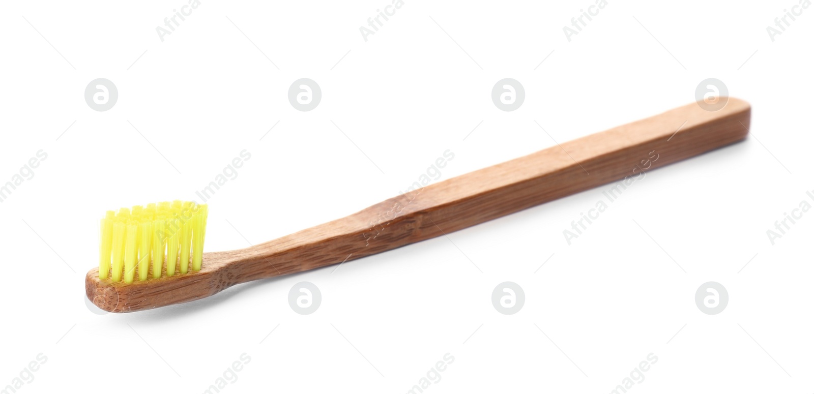 Photo of Toothbrush made of bamboo on white background