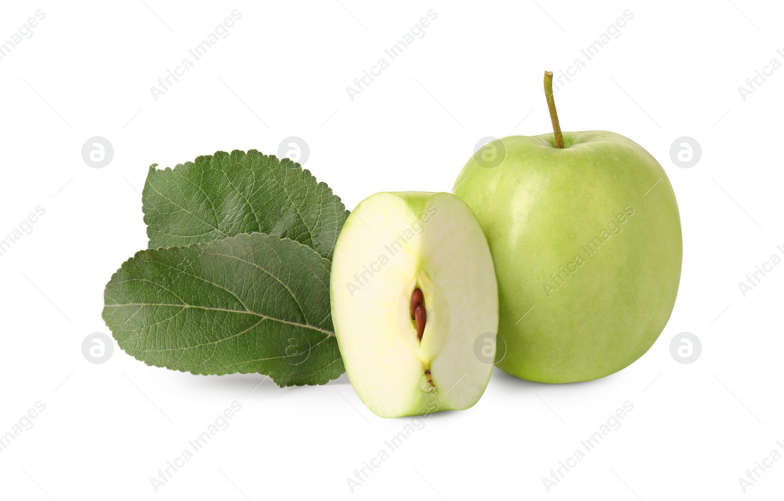 Photo of Whole, cut green apples and leaves isolated on white