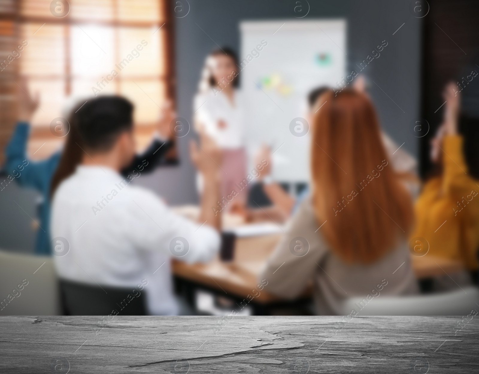 Image of Empty stone surface and blurred view of seminar in modern office, closeup. Space for text 