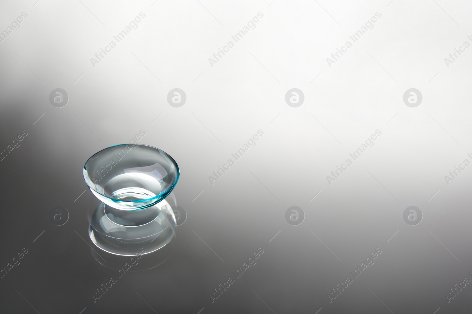 Photo of Contact lens on grey background