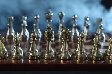 Photo of Set of chess pieces on checkerboard before game, selective focus