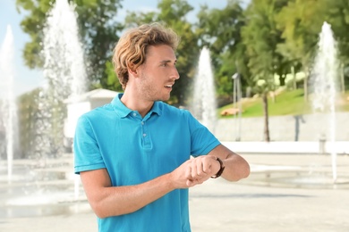 Photo of Portrait of handsome young man on street