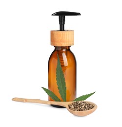 Bottle of hemp cosmetics with green leaf and seeds isolated on white