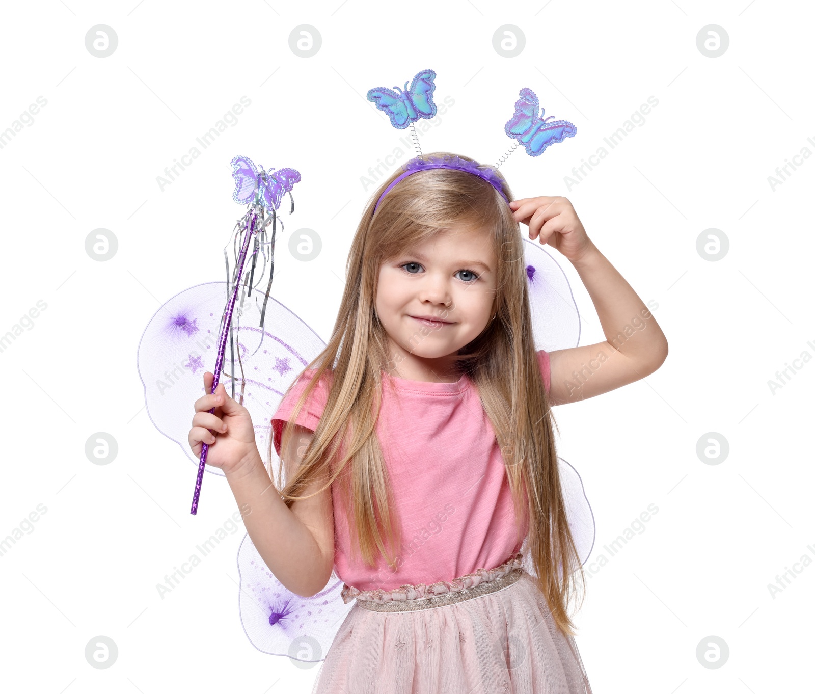 Photo of Cute little girl in fairy costume with violet wings and magic wand on white background