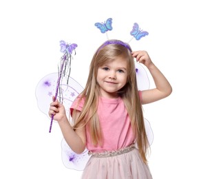 Photo of Cute little girl in fairy costume with violet wings and magic wand on white background