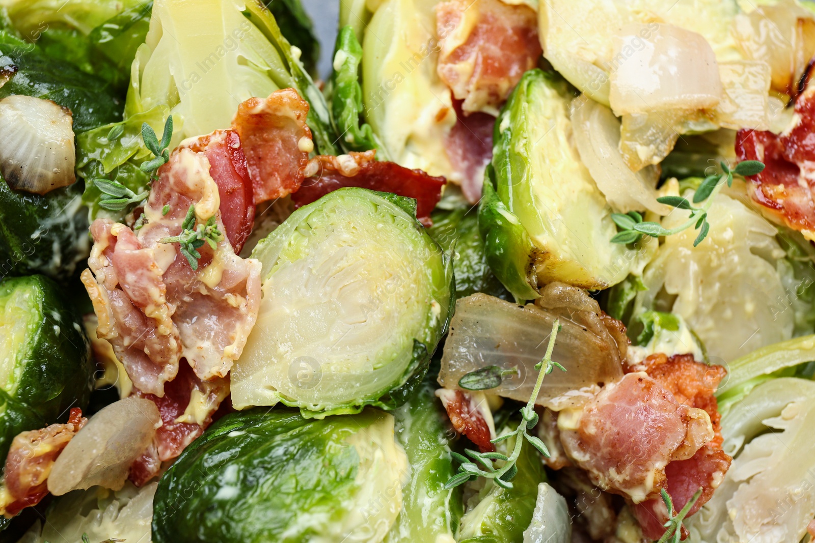 Photo of Delicious cooked Brussels sprouts with bacon, closeup