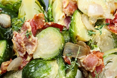 Delicious cooked Brussels sprouts with bacon, closeup