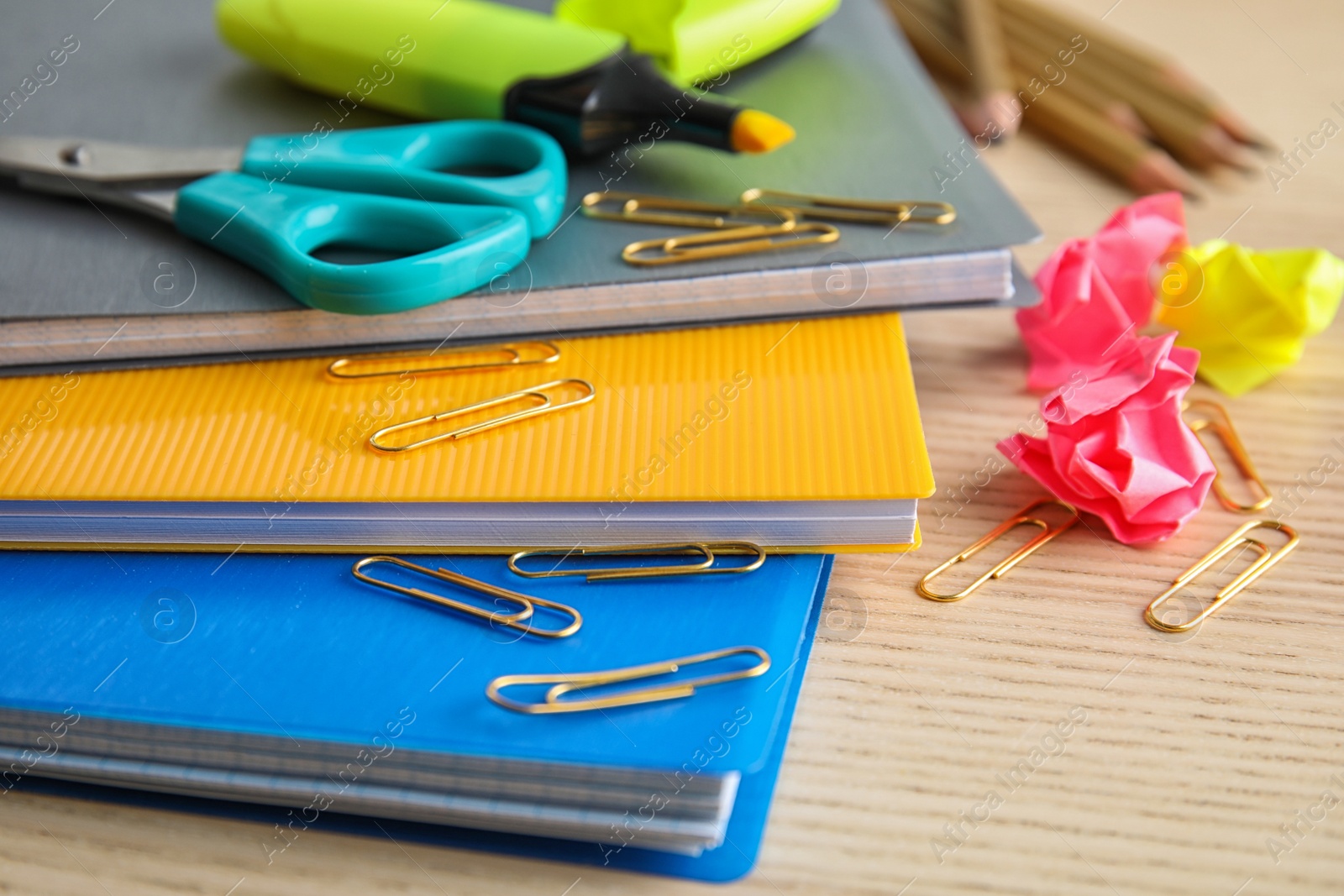 Photo of Different colorful stationery on wooden table. Back to school