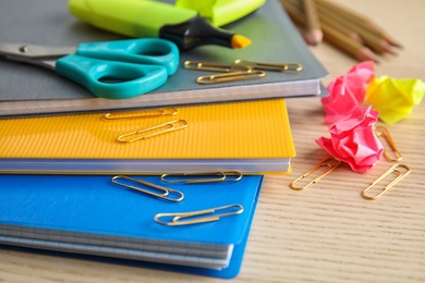 Photo of Different colorful stationery on wooden table. Back to school