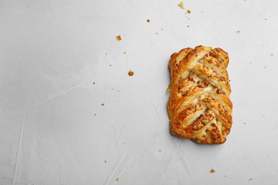 Photo of Fresh delicious puff pastry on grey table, top view. Space for text