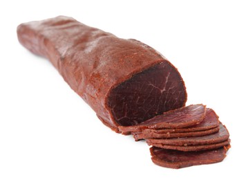 Photo of Delicious sliced dry-cured beef basturma on white background