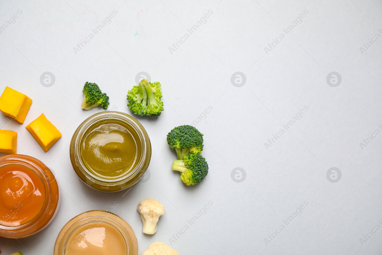 Photo of Healthy baby food and ingredients on white background, top view