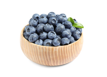 Fresh ripe blueberries in wooden bowl on white background