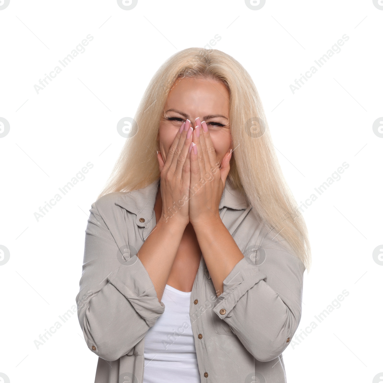 Photo of Embarrassed woman covering mouth with hands on white background