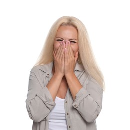 Embarrassed woman covering mouth with hands on white background