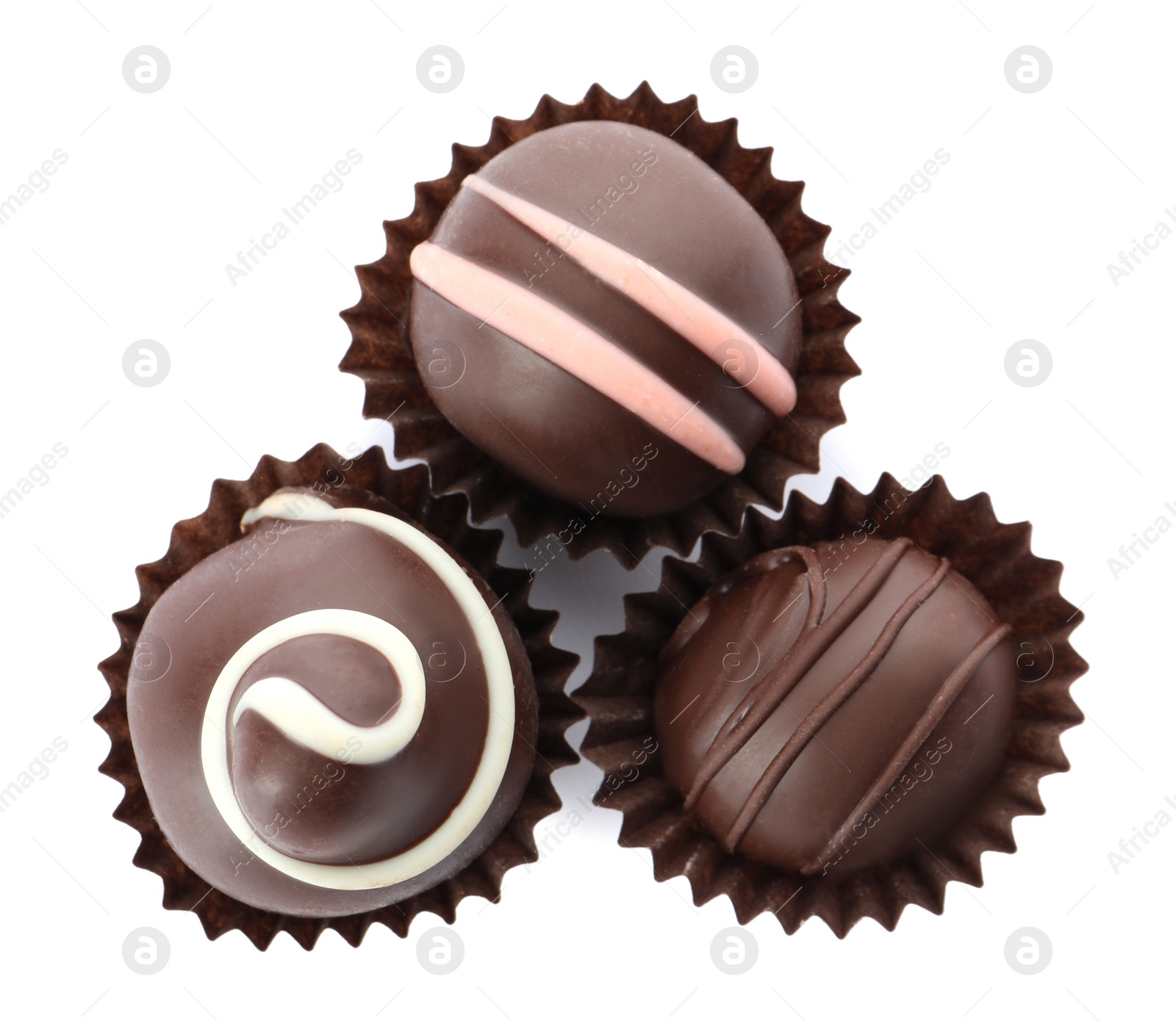 Photo of Many different delicious chocolate truffles on white background, top view