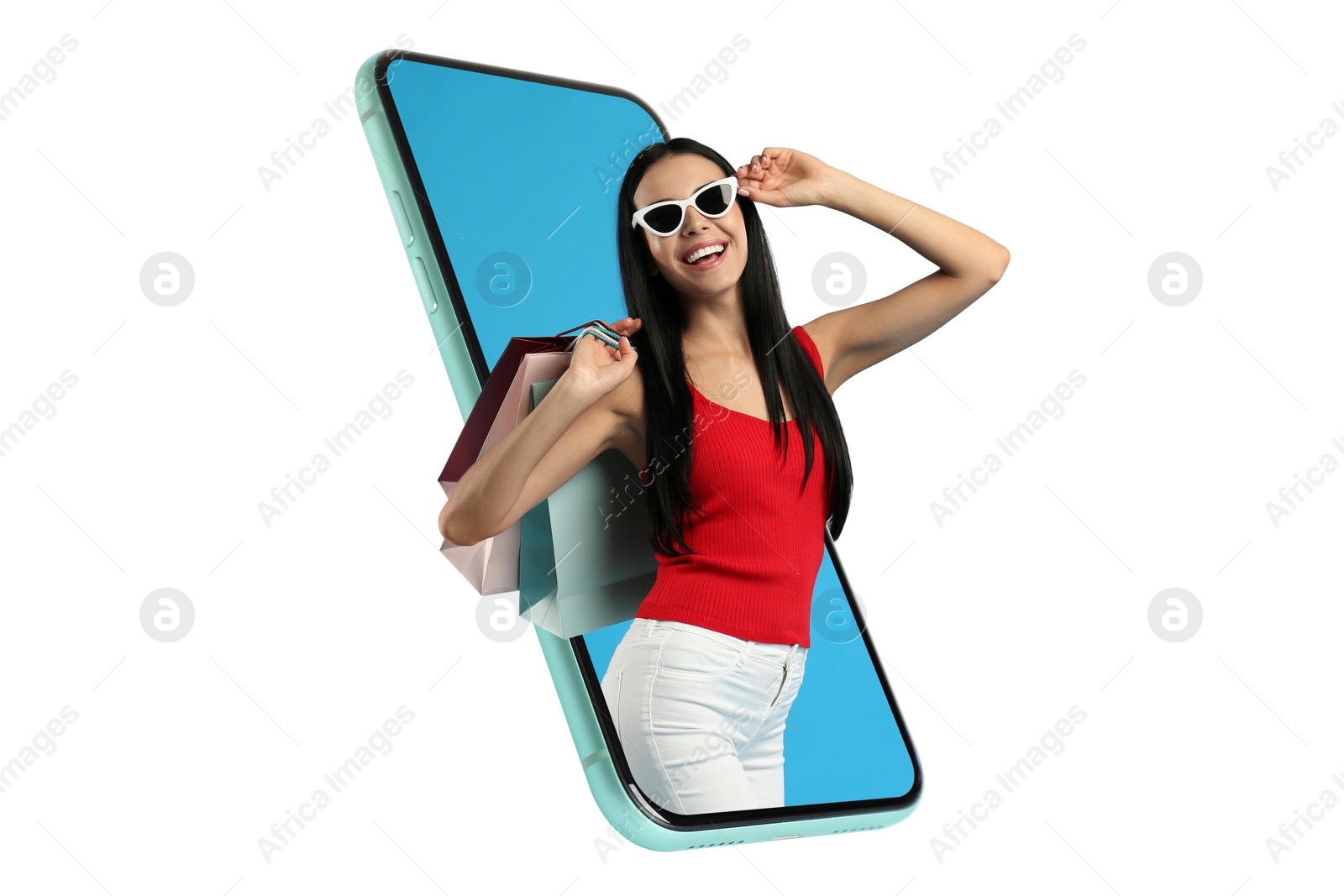 Image of Online shopping. Happy woman with paper bags looking out from smartphone on white background