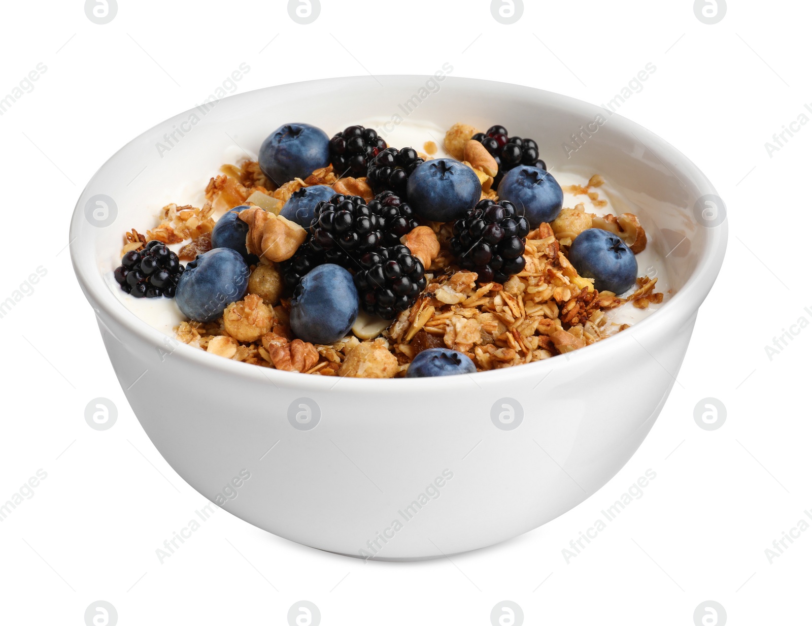 Photo of Bowl of healthy muesli with berries and yogurt isolated on white