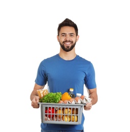 Man holding basket with fresh products on white background. Food delivery service