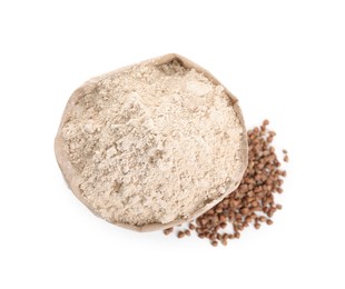 Photo of Paper bag with buckwheat flour and grains isolated on white, top view