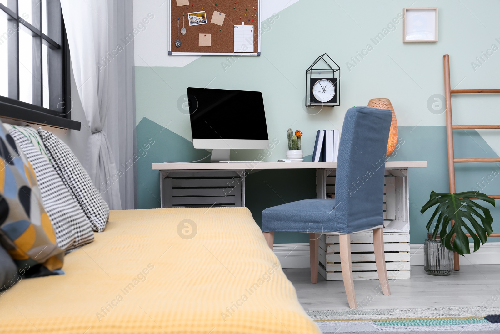 Photo of Comfortable workplace with computer on desk in home office