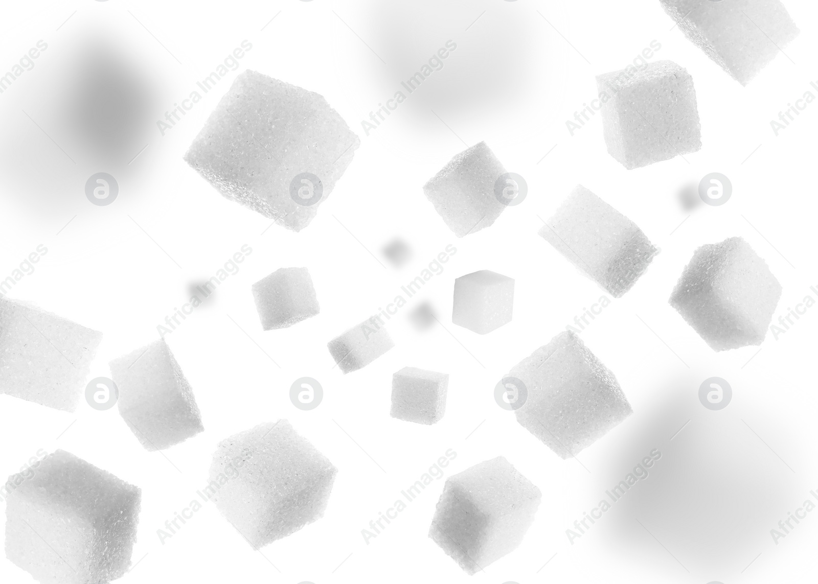 Image of Refined sugar cubes in air on white background