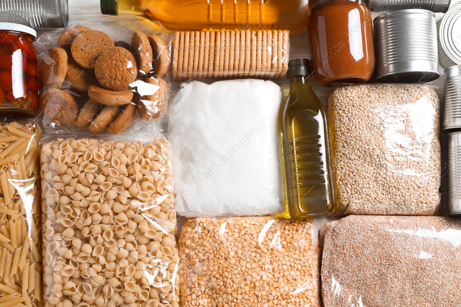 Photo of Many products on table, flat lay. Food donation