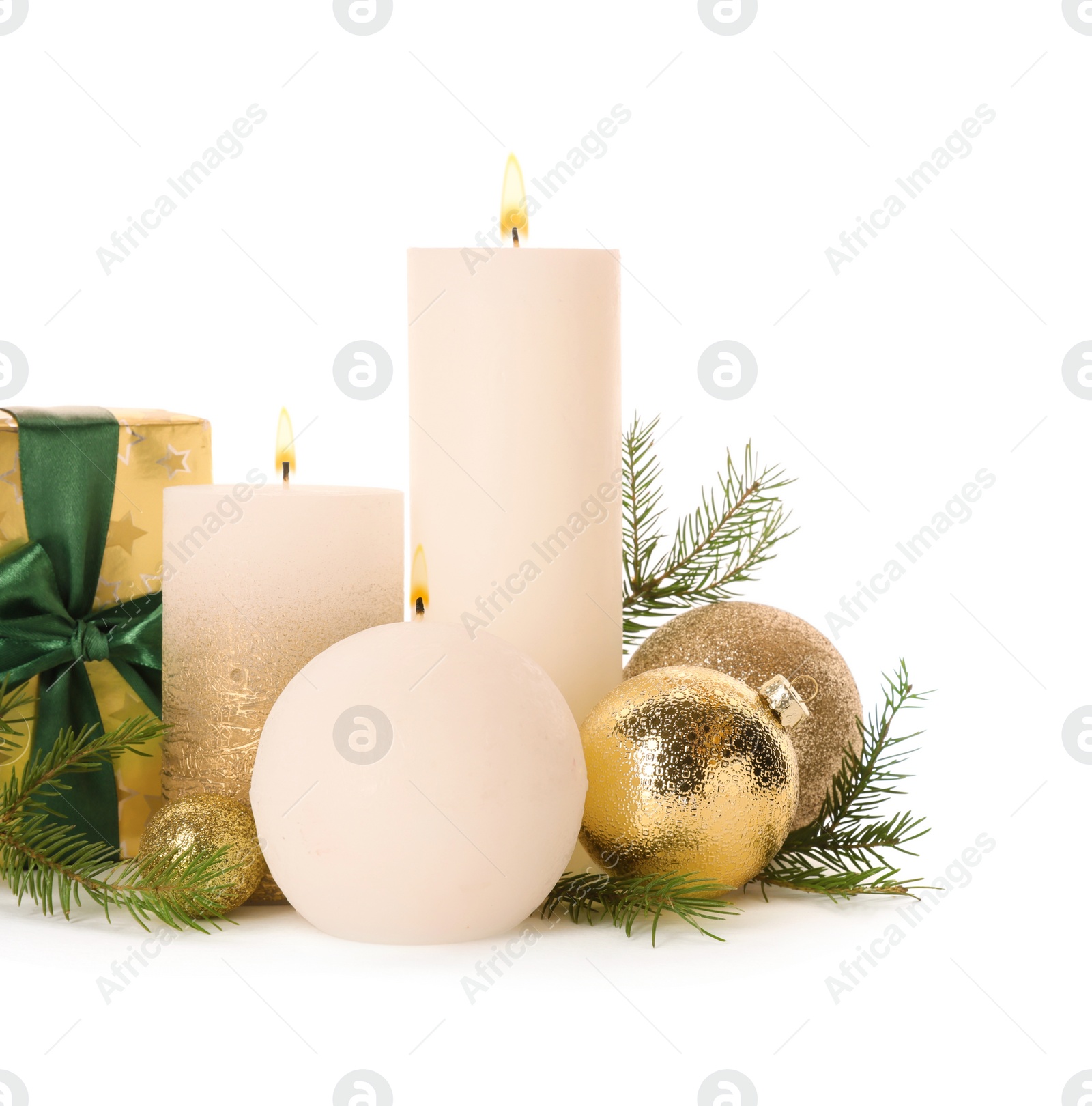 Photo of Beautiful burning candles with Christmas decor on white background