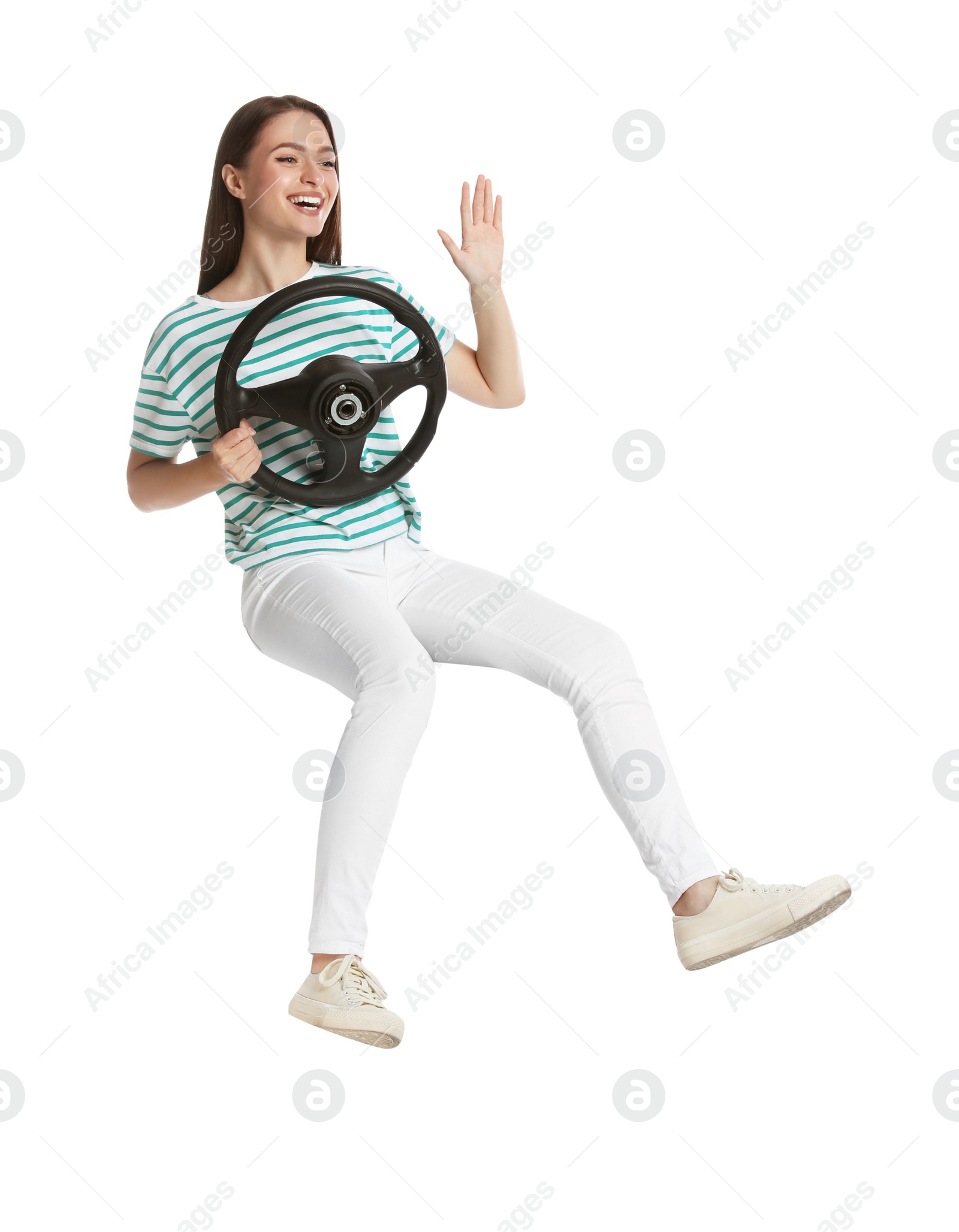 Photo of Young woman with steering wheel against white background