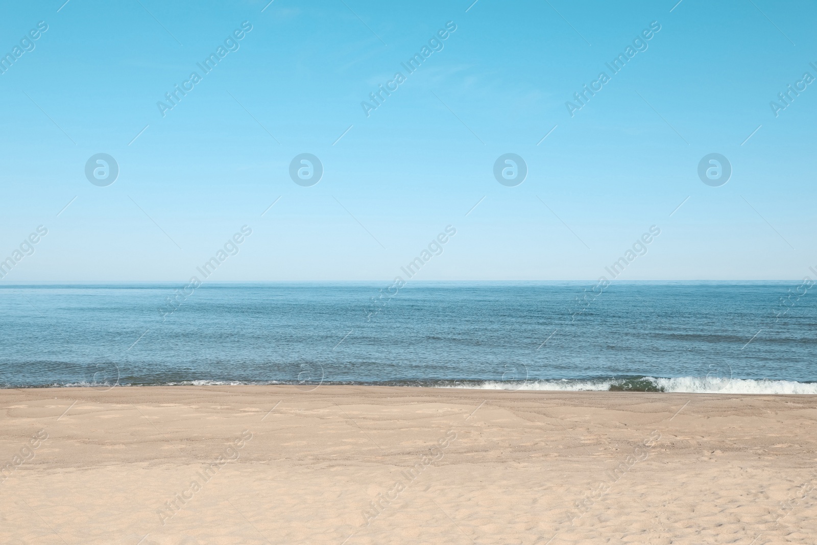 Photo of Picturesque view of sandy beach near sea