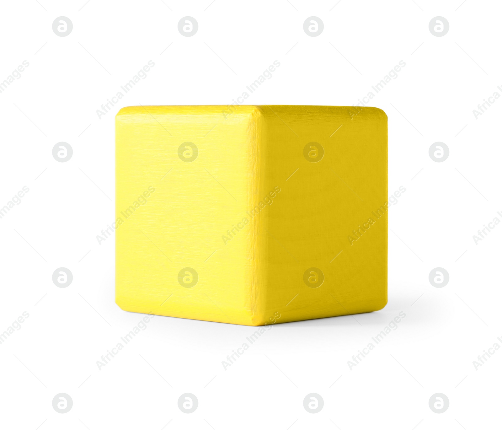 Photo of Yellow wooden toy cube isolated on white