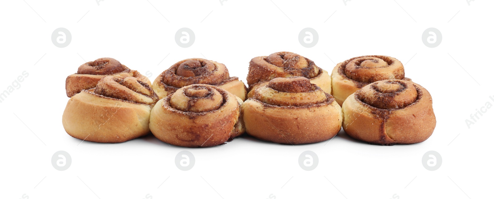 Photo of Many tasty cinnamon rolls isolated on white