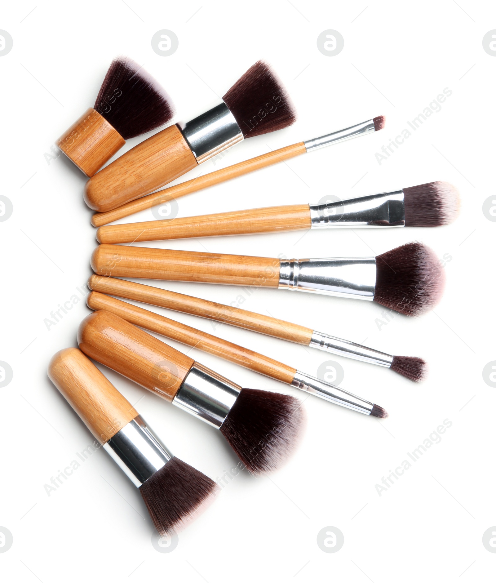 Photo of Makeup brushes of professional artist on white background