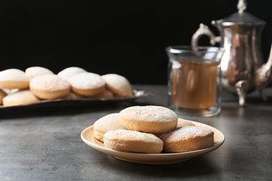 Traditional cookies for Islamic holidays and tea on table. Eid Mubarak