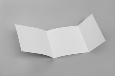 Blank paper brochure on light grey background. Mockup for design