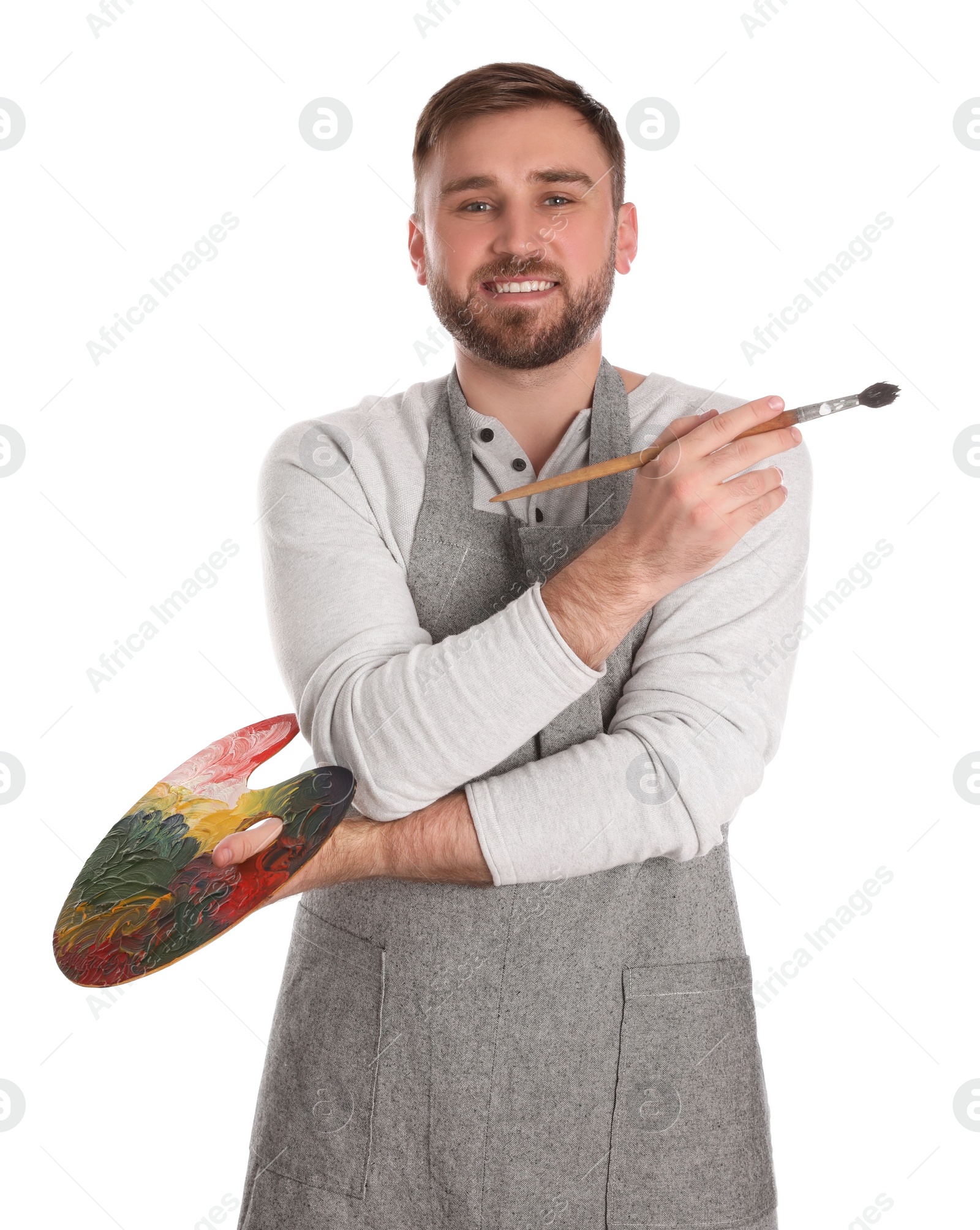 Photo of Man with painting tools on white background. Young artist