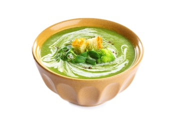 Bowl of broccoli cream soup with croutons on white background