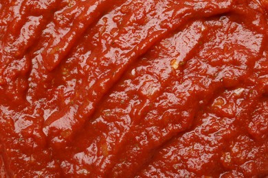 Photo of Homemade tomato sauce as background, top view