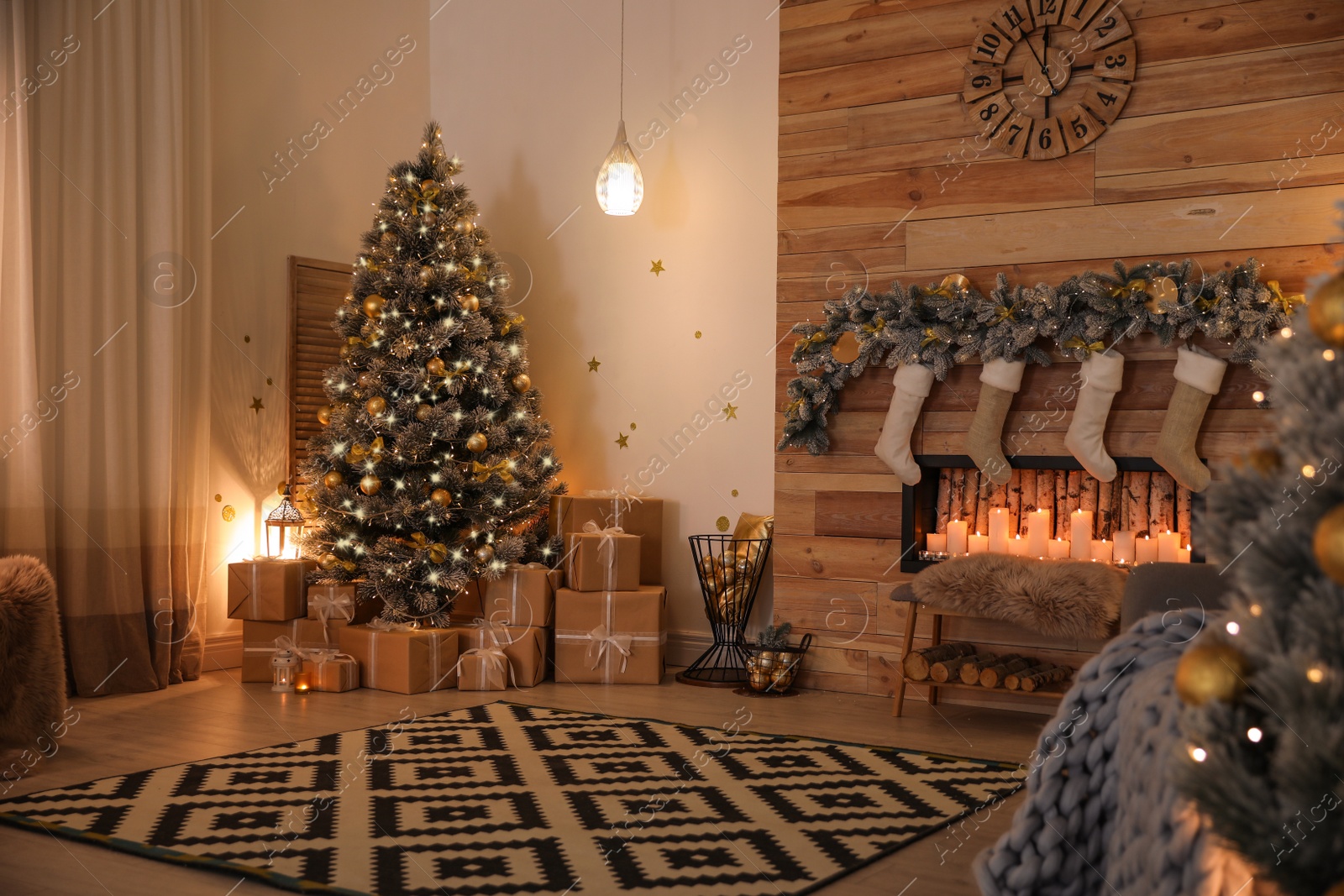 Photo of Stylish room interior with beautiful Christmas tree and decorative fireplace