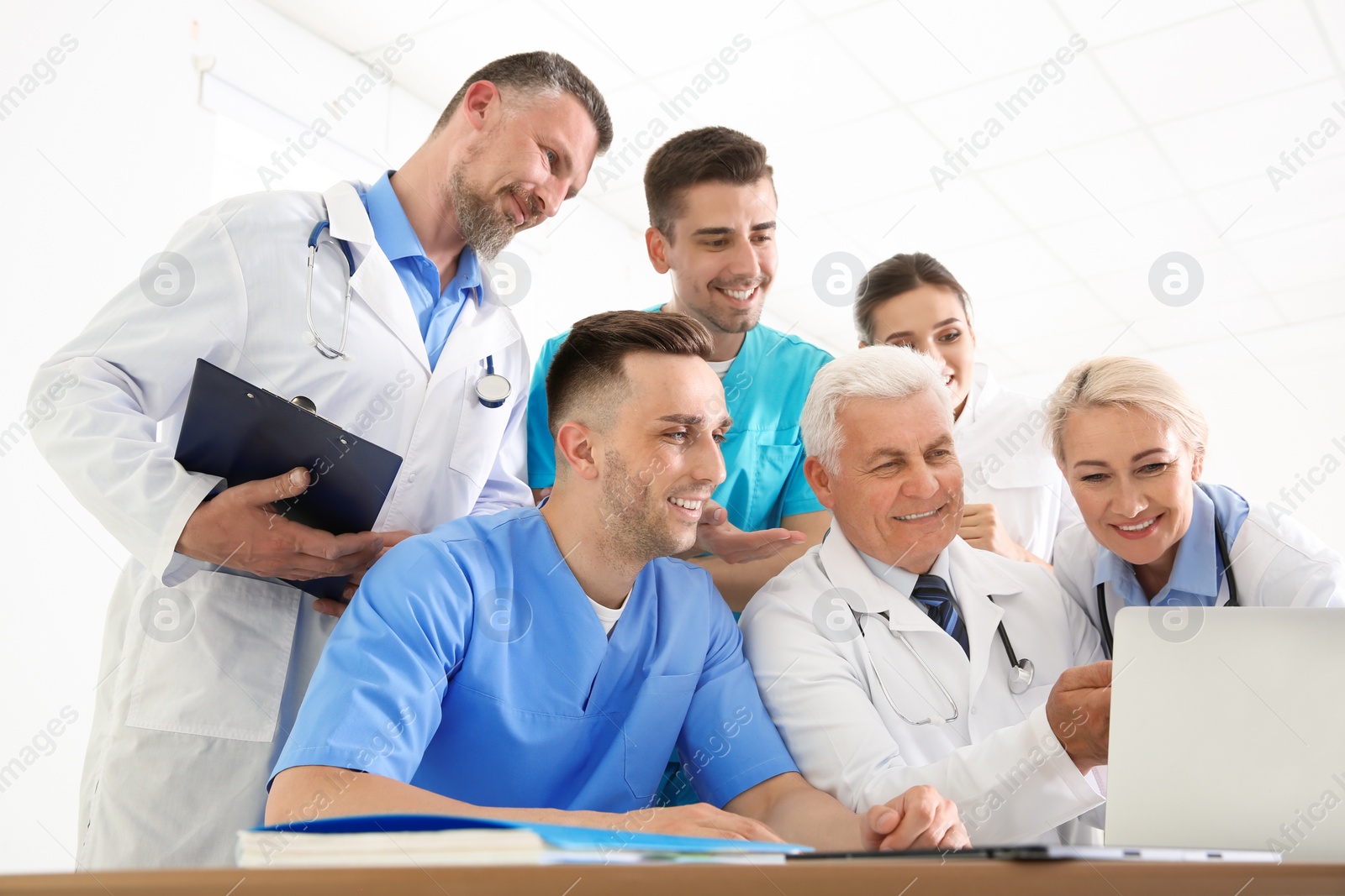 Photo of Group of doctors attending meeting in clinic. Cardiology conference