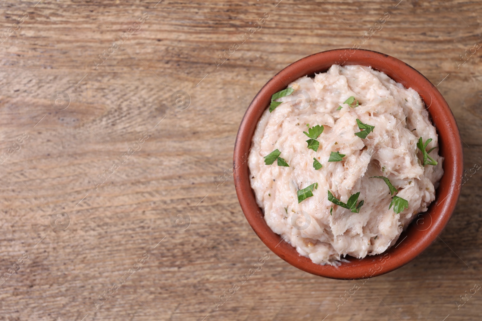 Photo of Delicious lard spread on wooden table, top view. Space for text