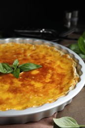 Delicious pie with minced meat on wooden table, closeup