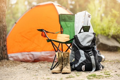 Photo of Set of camping equipment outdoors on summer day
