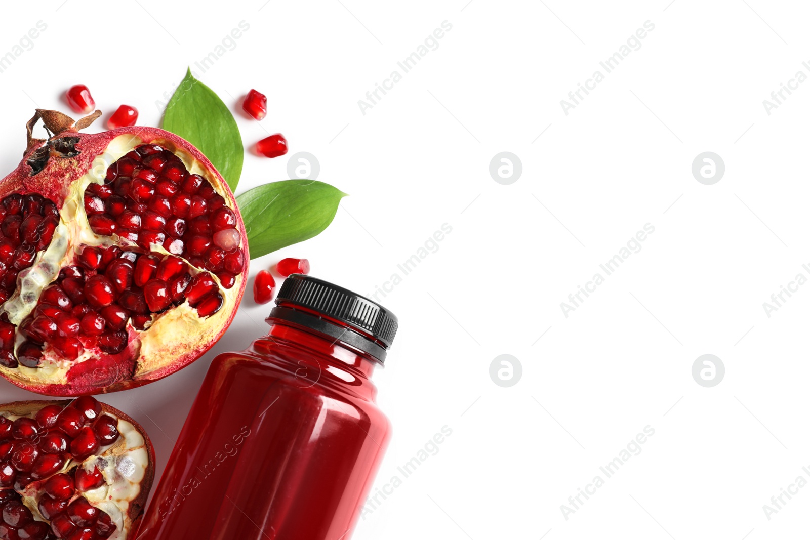 Photo of Bottle of pomegranate juice and fresh fruits on white background, top view