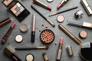 Photo of Set of luxury makeup products on grey background, flat lay